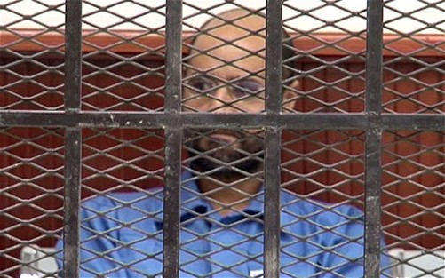 卡扎菲次子出庭受审神情冷淡 法院推迟审判