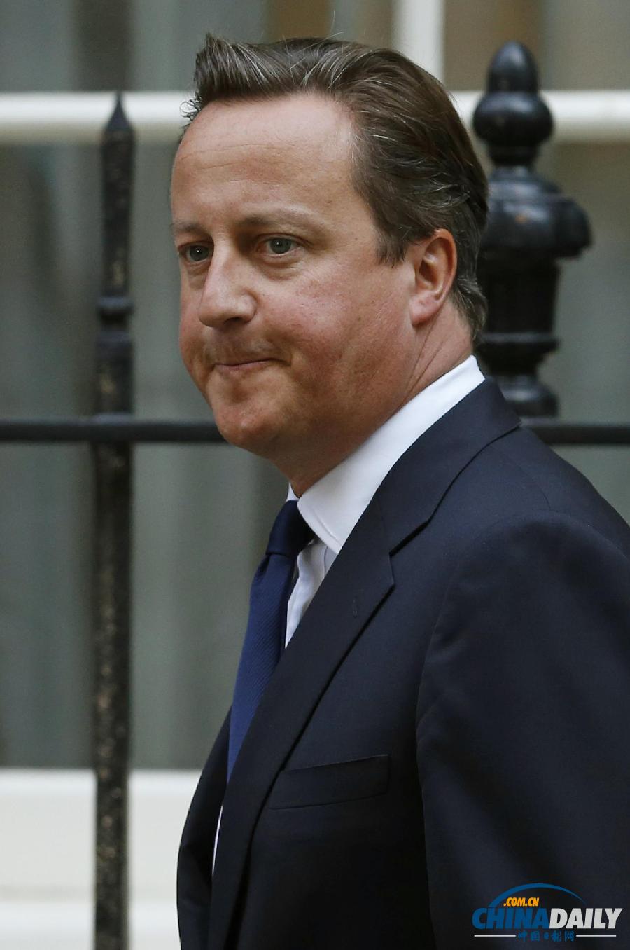 英国首相卡梅伦不敌议会反对 暂时搁置干预提议