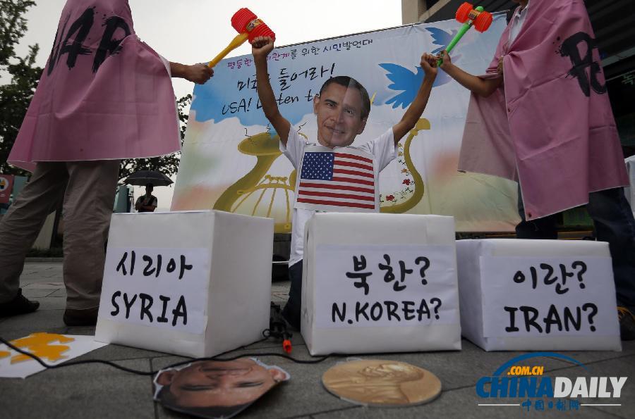 韩国民众抗议美军事干预叙利亚 当街棒打“奥巴马”