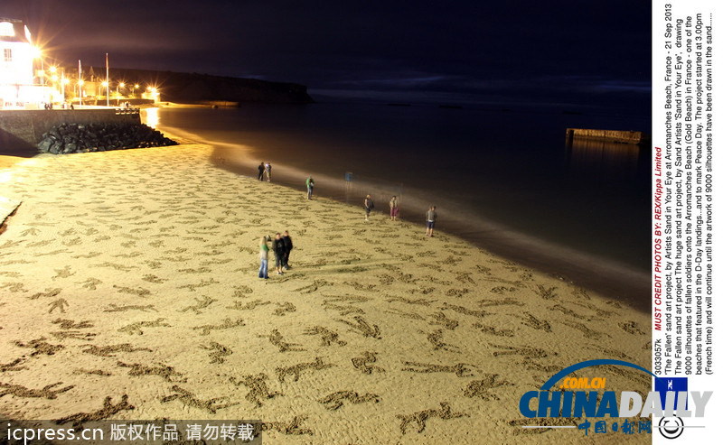 艺术家沙滩打造9000个阵亡士兵剪影 纪念世界和平日
