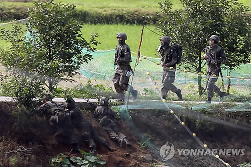 韩军发现枪击事件肇事者 双方开枪对峙