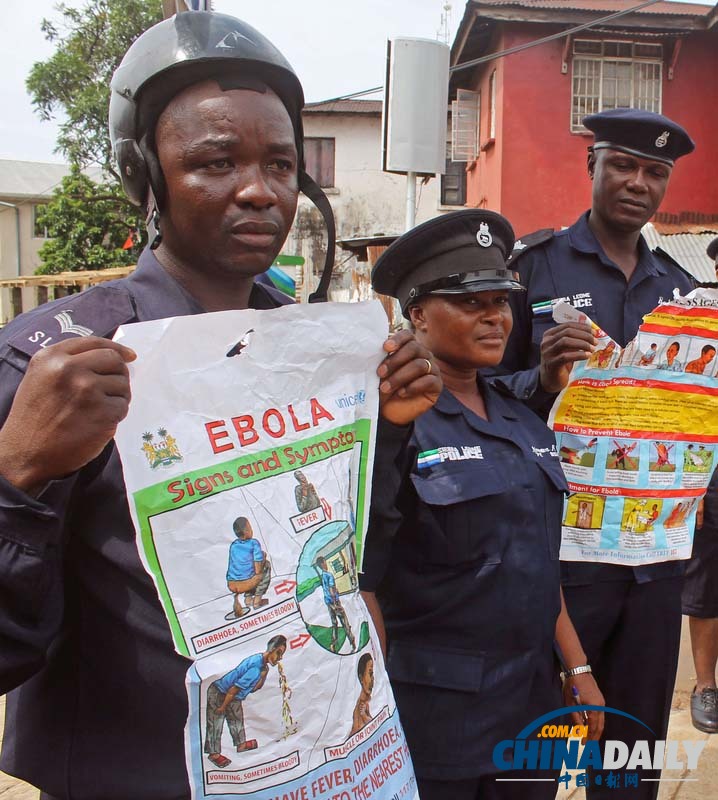 塞拉利昂警察街头宣传埃博拉病毒知识