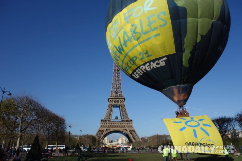 巴黎组织“大头”行动 呼吁领导人携手达成气候大会协议