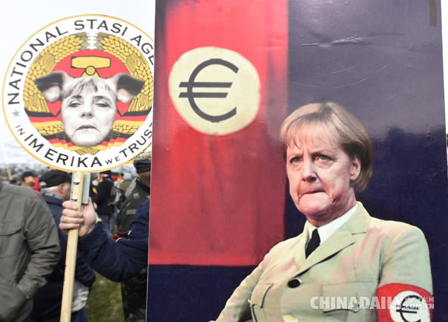 德国举行反伊斯兰化示威 默克尔遭恶搞成纳粹